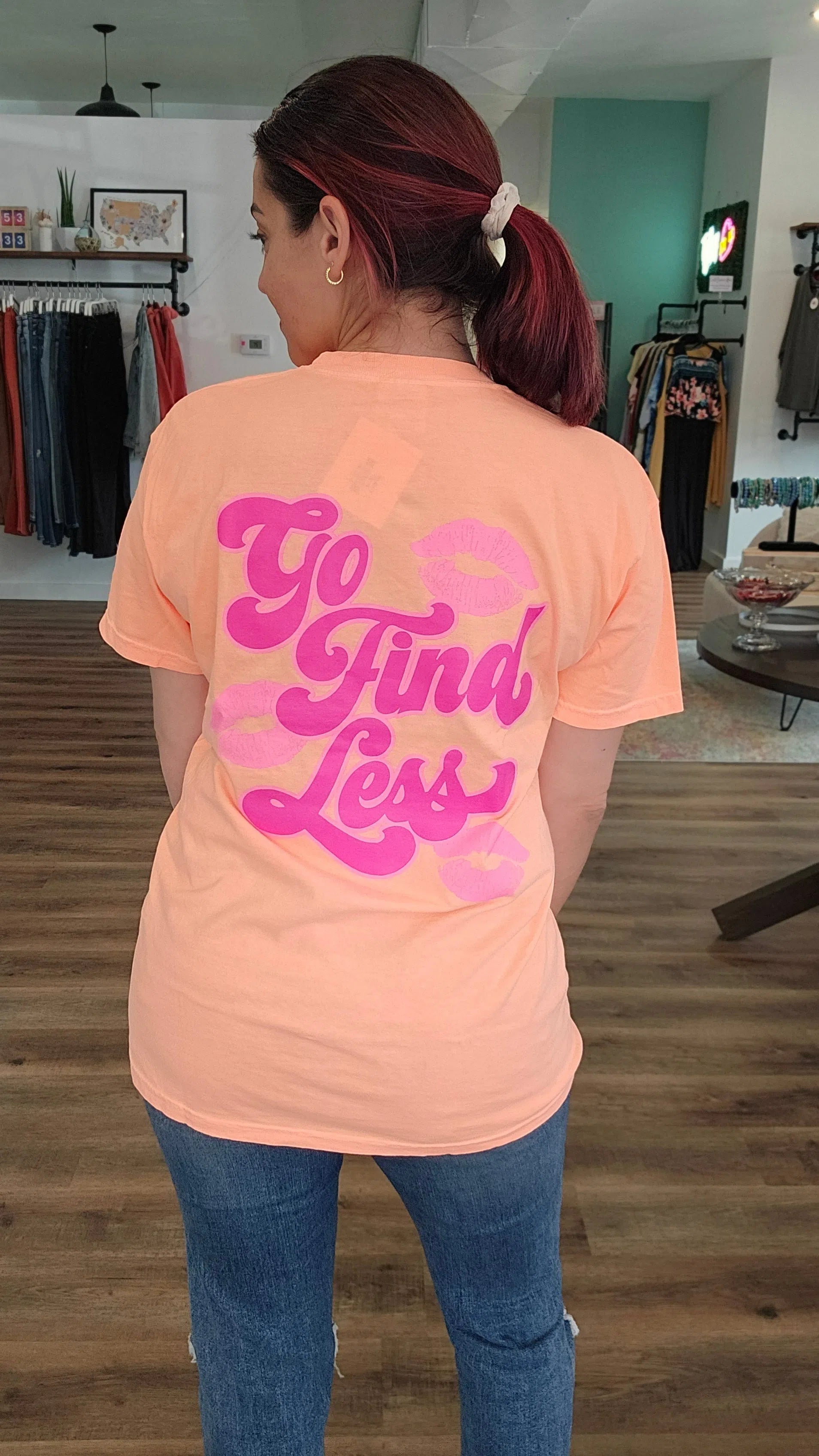 Shop Go Find Less-Graphic Tee at Ruby Joy Boutique, a Women's Clothing Store in Pickerington, Ohio