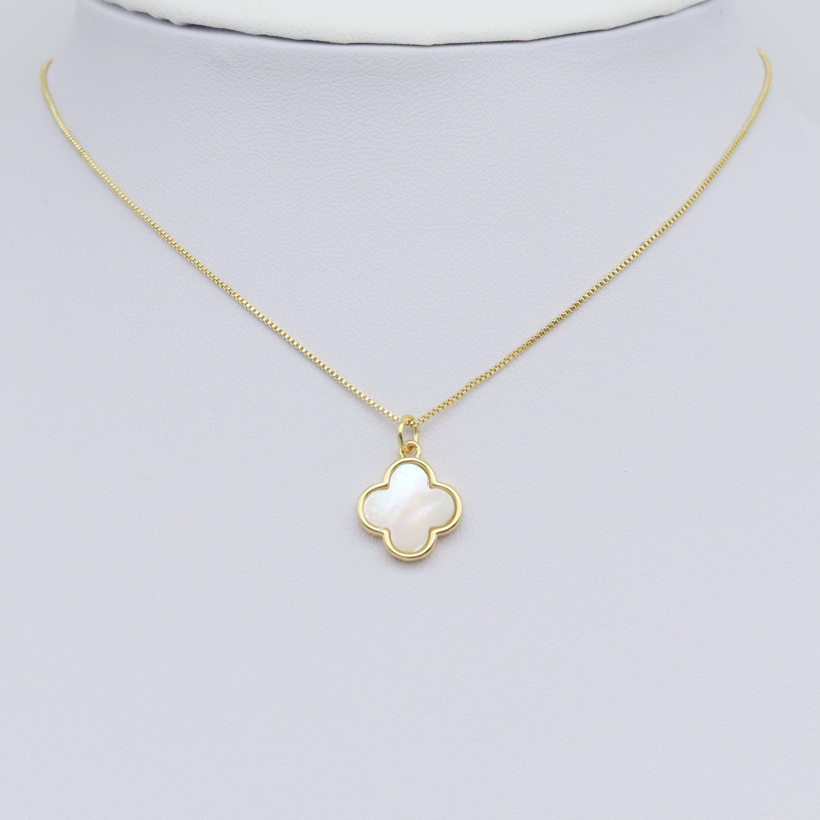 Shop Gold and Mother of Pearl Quatrefoil Charm- at Ruby Joy Boutique, a Women's Clothing Store in Pickerington, Ohio