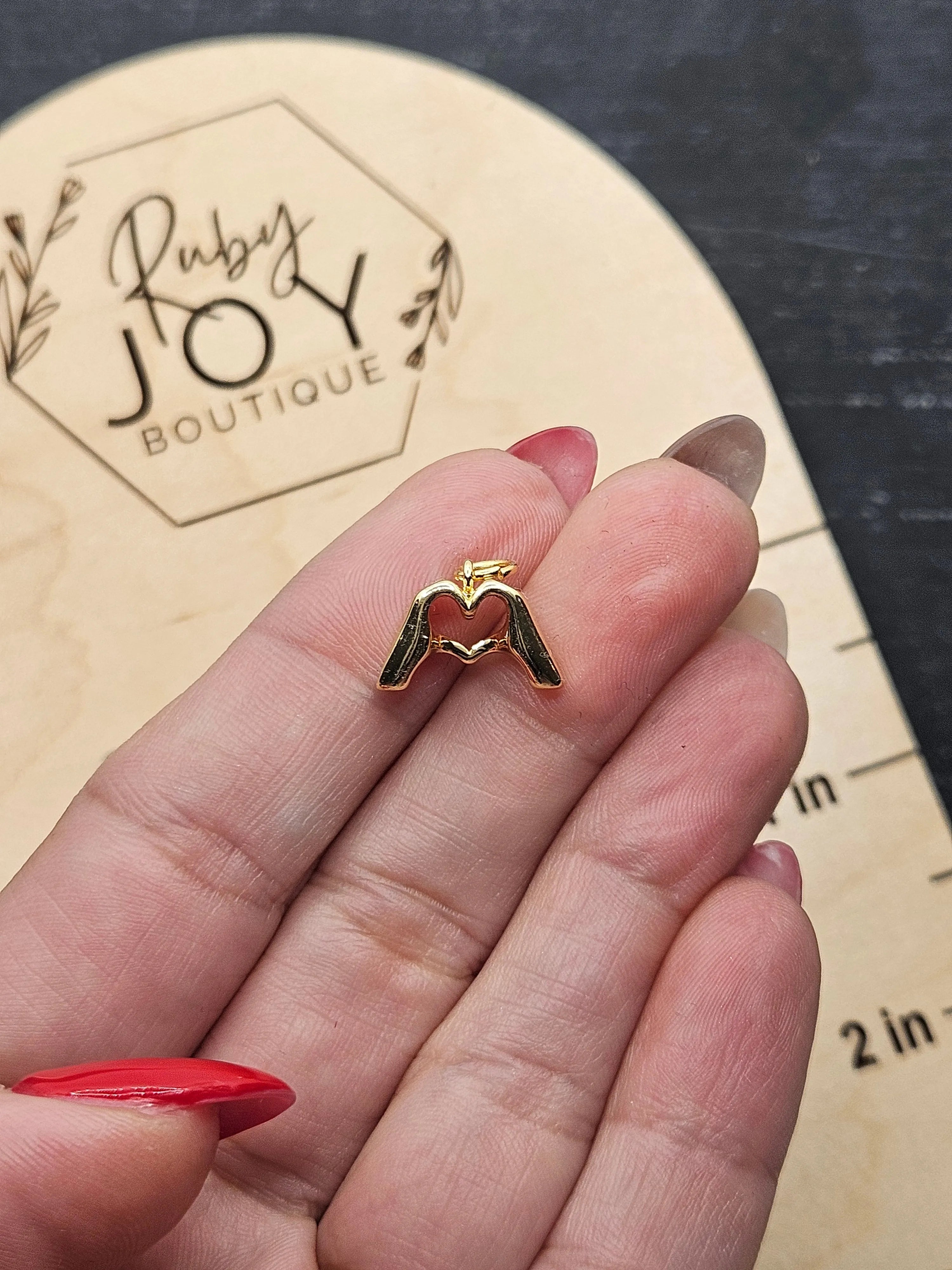 Shop Heart Hands Charm- at Ruby Joy Boutique, a Women's Clothing Store in Pickerington, Ohio