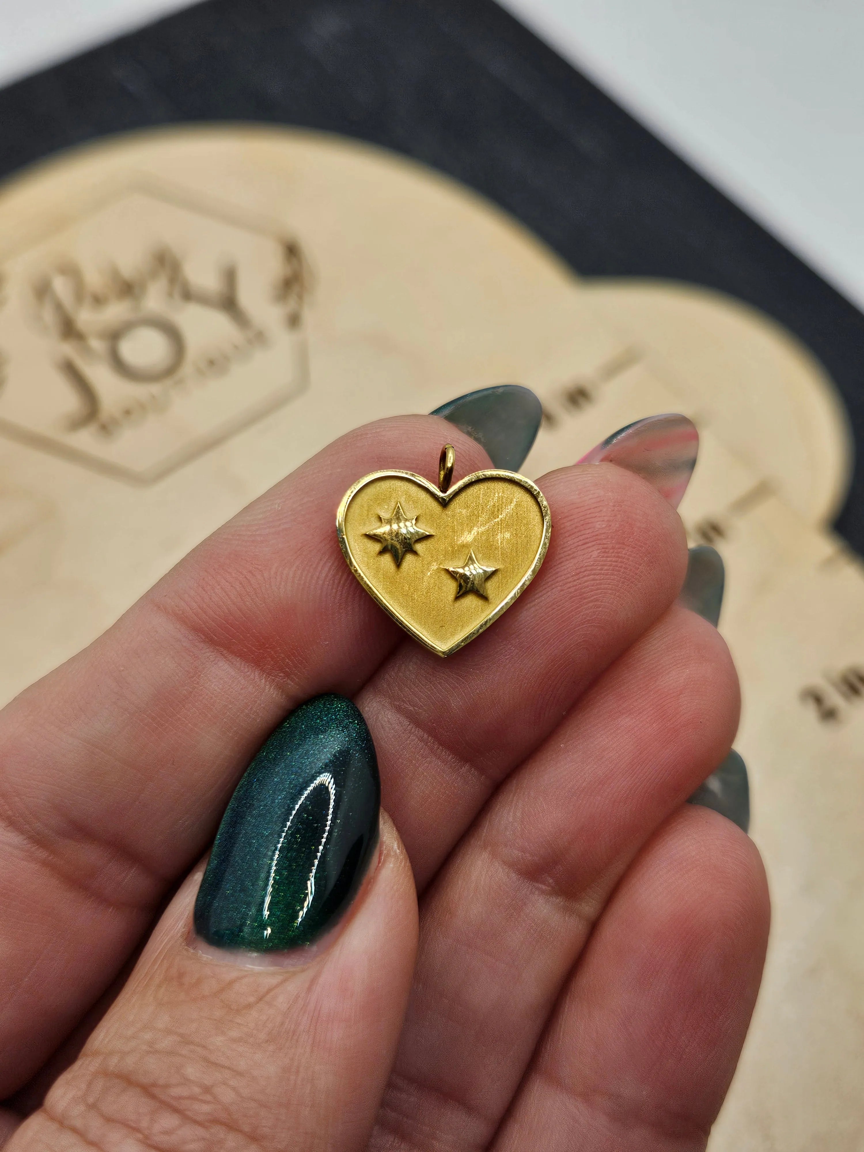 Shop Heart with Stars Charm- at Ruby Joy Boutique, a Women's Clothing Store in Pickerington, Ohio