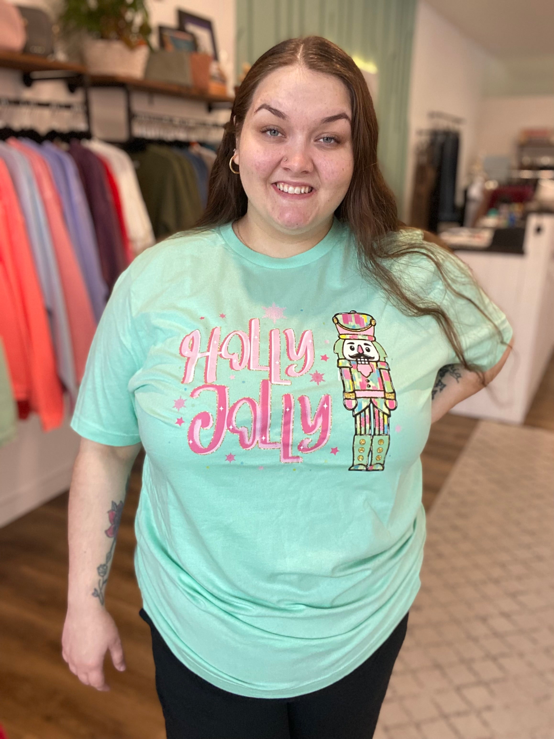 Shop Holly Jolly Bright Nutcracker Tee-Graphic Tee at Ruby Joy Boutique, a Women's Clothing Store in Pickerington, Ohio