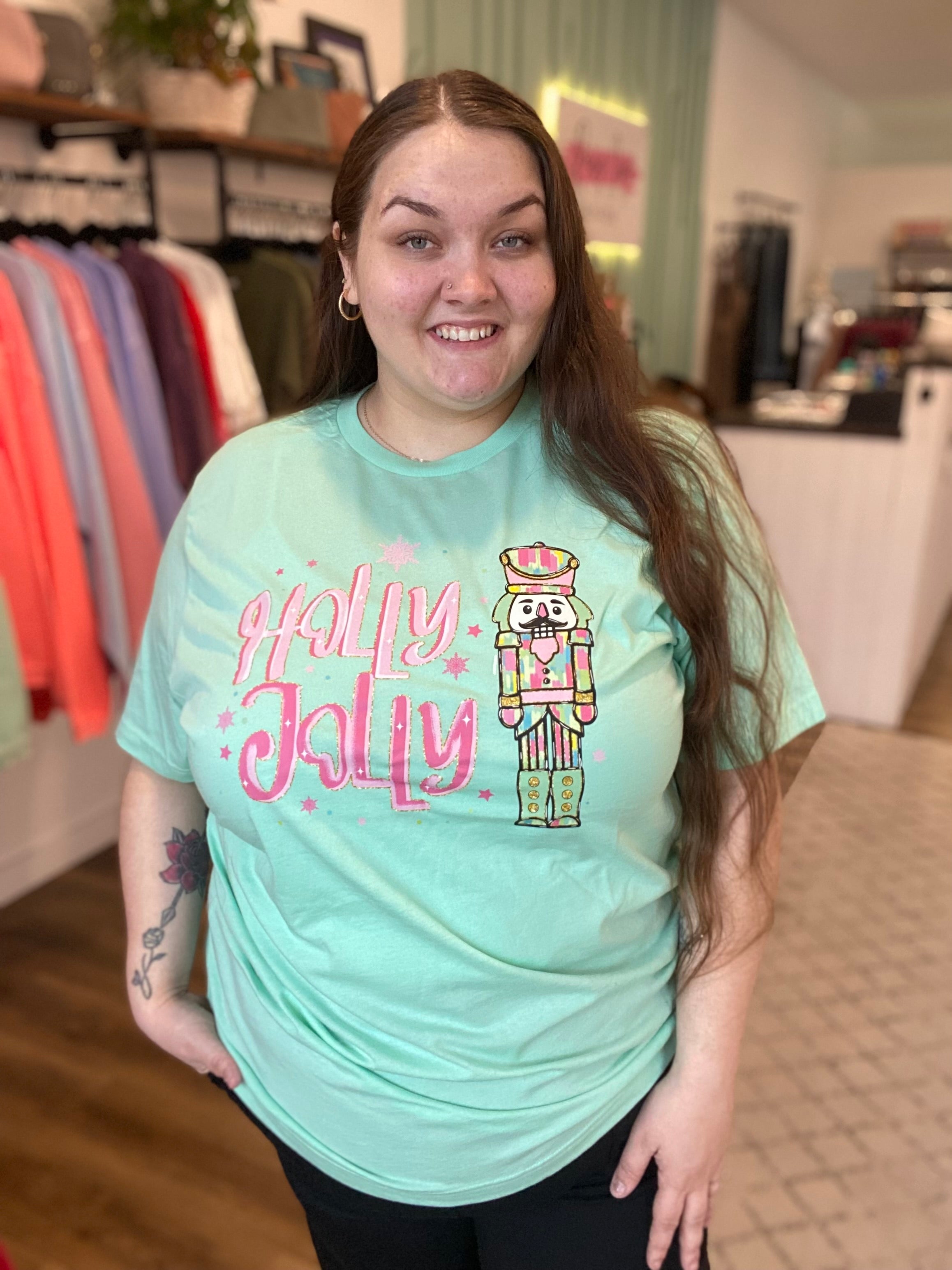 Shop Holly Jolly Bright Nutcracker Tee-Graphic Tee at Ruby Joy Boutique, a Women's Clothing Store in Pickerington, Ohio