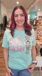 Shop Holly Jolly Bright Nutcracker Tee-Graphic Tee at Ruby Joy Boutique, a Women's Clothing Store in Pickerington, Ohio