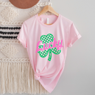Shop Lucky Checkered Shamrock | St. Patrick's Day Graphic Top- at Ruby Joy Boutique, a Women's Clothing Store in Pickerington, Ohio