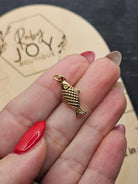 Shop Lucky Fish Charm- at Ruby Joy Boutique, a Women's Clothing Store in Pickerington, Ohio