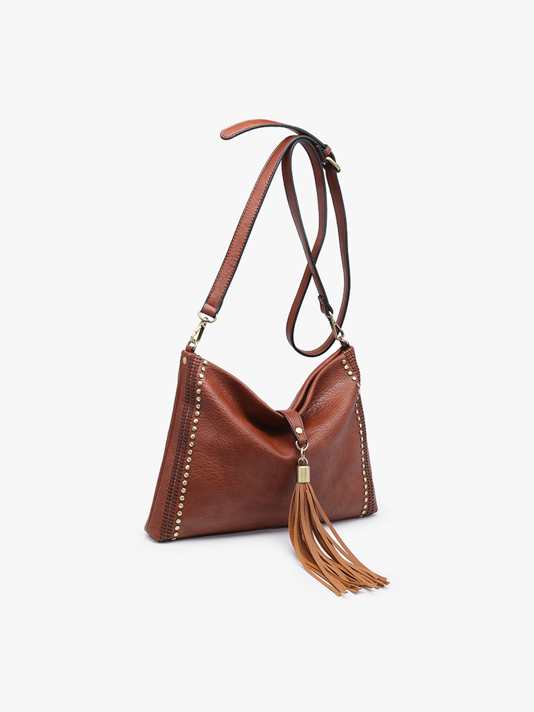 Shop Marie Crossbody with Grommet Details and Tassel-Purse at Ruby Joy Boutique, a Women's Clothing Store in Pickerington, Ohio