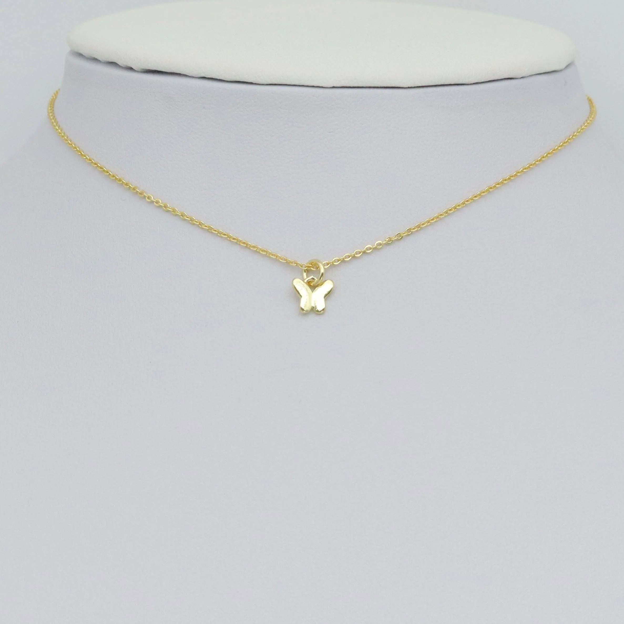 Shop Mini Gold Butterfly Charm- at Ruby Joy Boutique, a Women's Clothing Store in Pickerington, Ohio