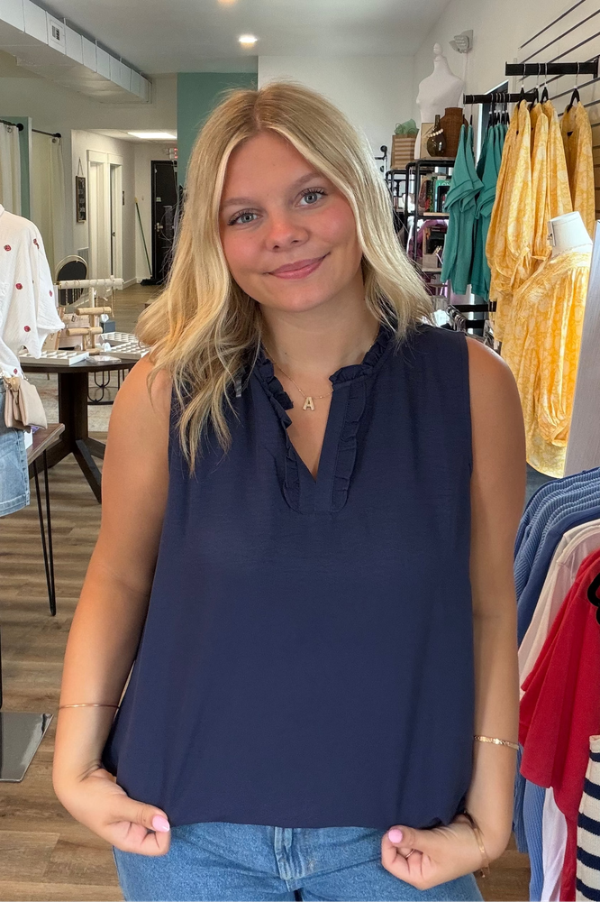 Shop Navy Ruffle Neck Sleeveless Blouse- at Ruby Joy Boutique, a Women's Clothing Store in Pickerington, Ohio