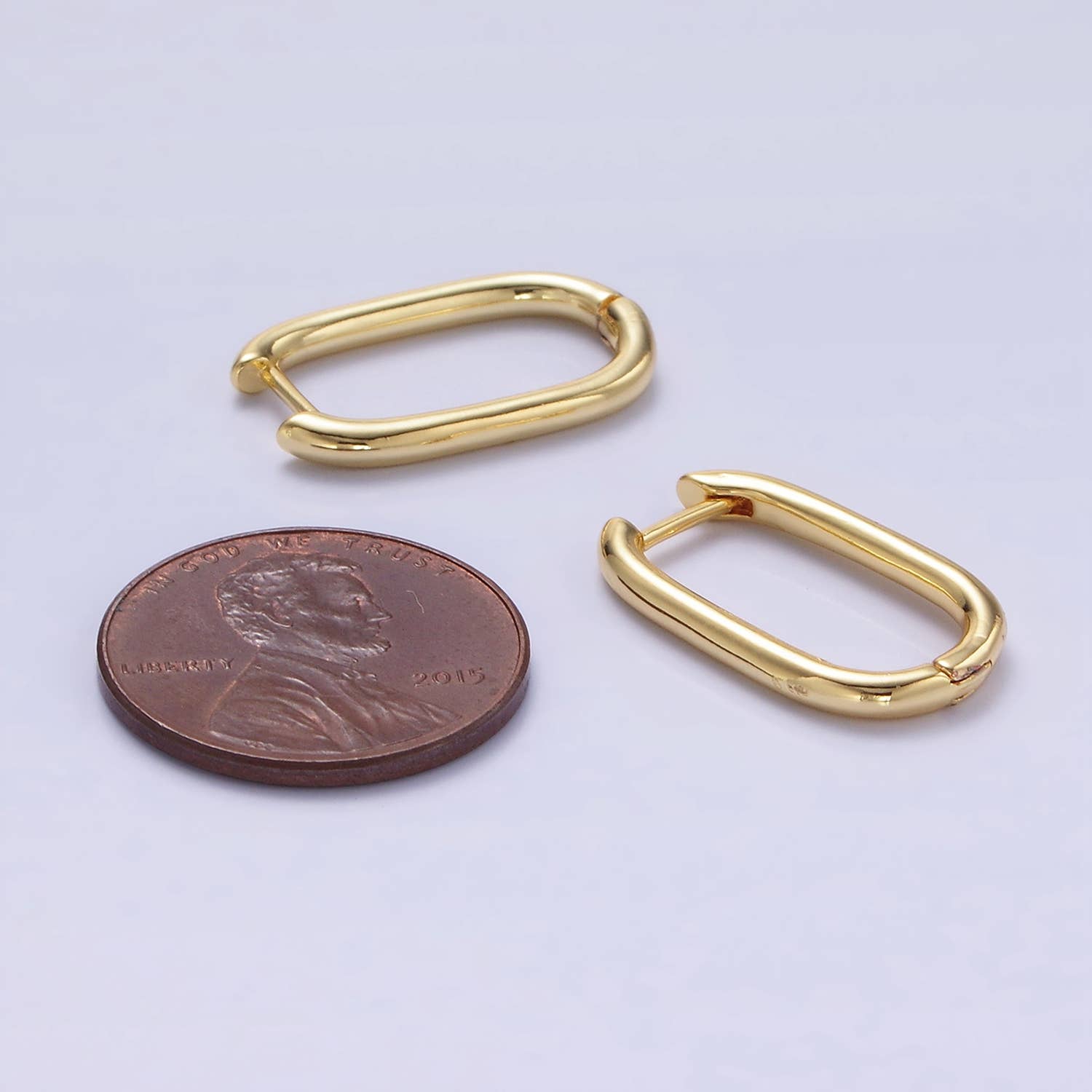 Shop Oblong Huggie Earrings- at Ruby Joy Boutique, a Women's Clothing Store in Pickerington, Ohio