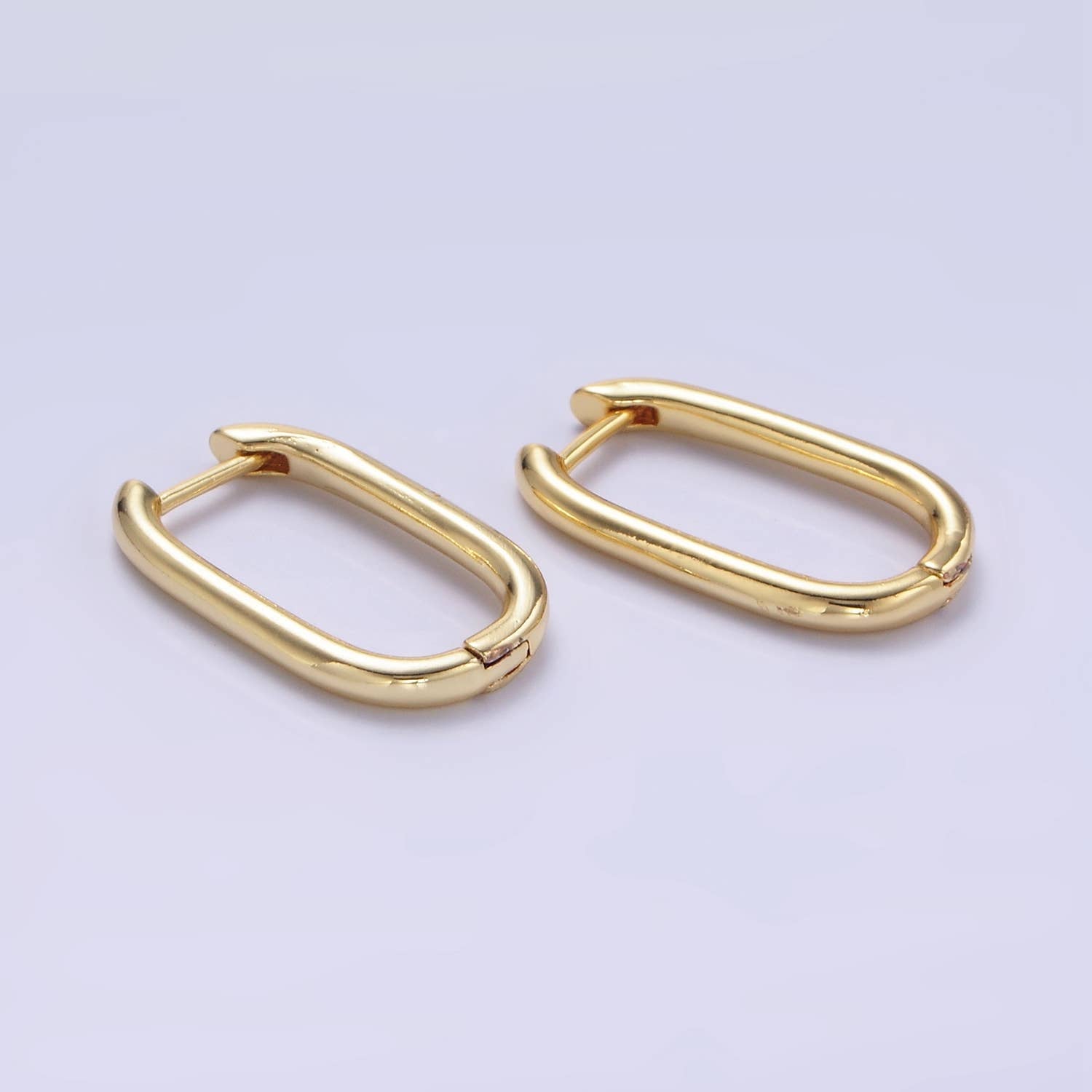 Shop Oblong Huggie Earrings- at Ruby Joy Boutique, a Women's Clothing Store in Pickerington, Ohio
