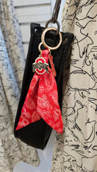 Shop Ohio State Buckeyes Logo Bandana Bag Charm- at Ruby Joy Boutique, a Women's Clothing Store in Pickerington, Ohio