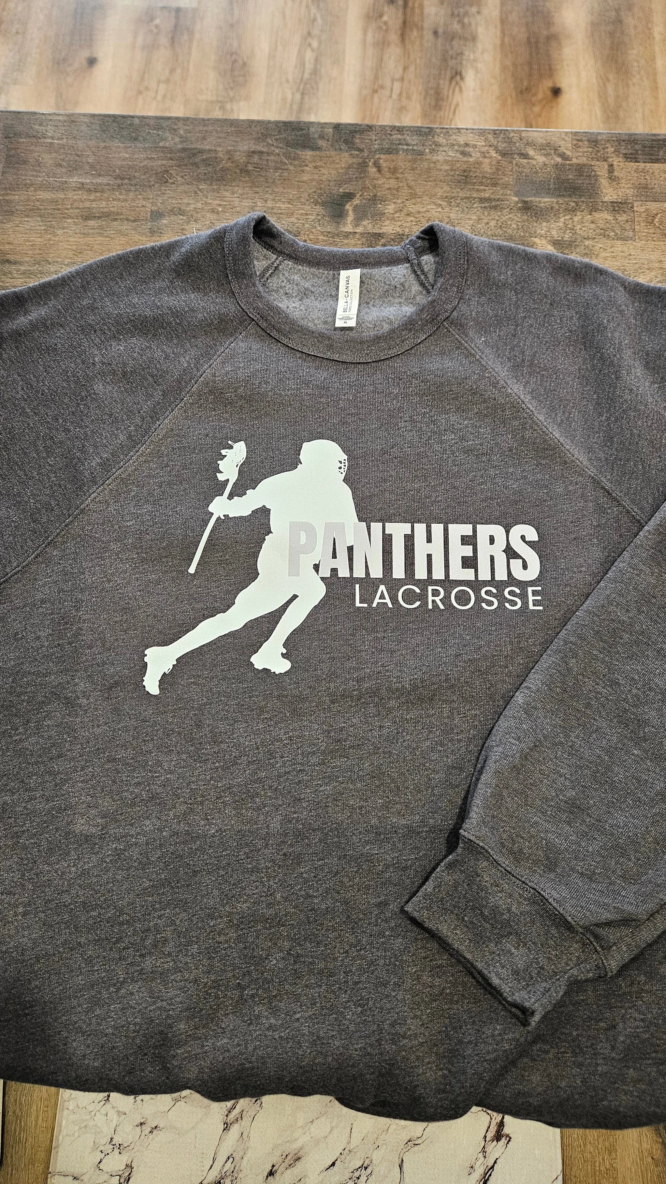 Shop Panthers Lacrosse Player Graphic- at Ruby Joy Boutique, a Women's Clothing Store in Pickerington, Ohio