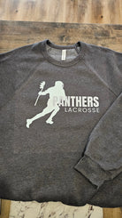 Shop Panthers Lacrosse Player Graphic- at Ruby Joy Boutique, a Women's Clothing Store in Pickerington, Ohio