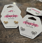 Shop Pave Bow Stud Earrings-Huggie Earrings at Ruby Joy Boutique, a Women's Clothing Store in Pickerington, Ohio