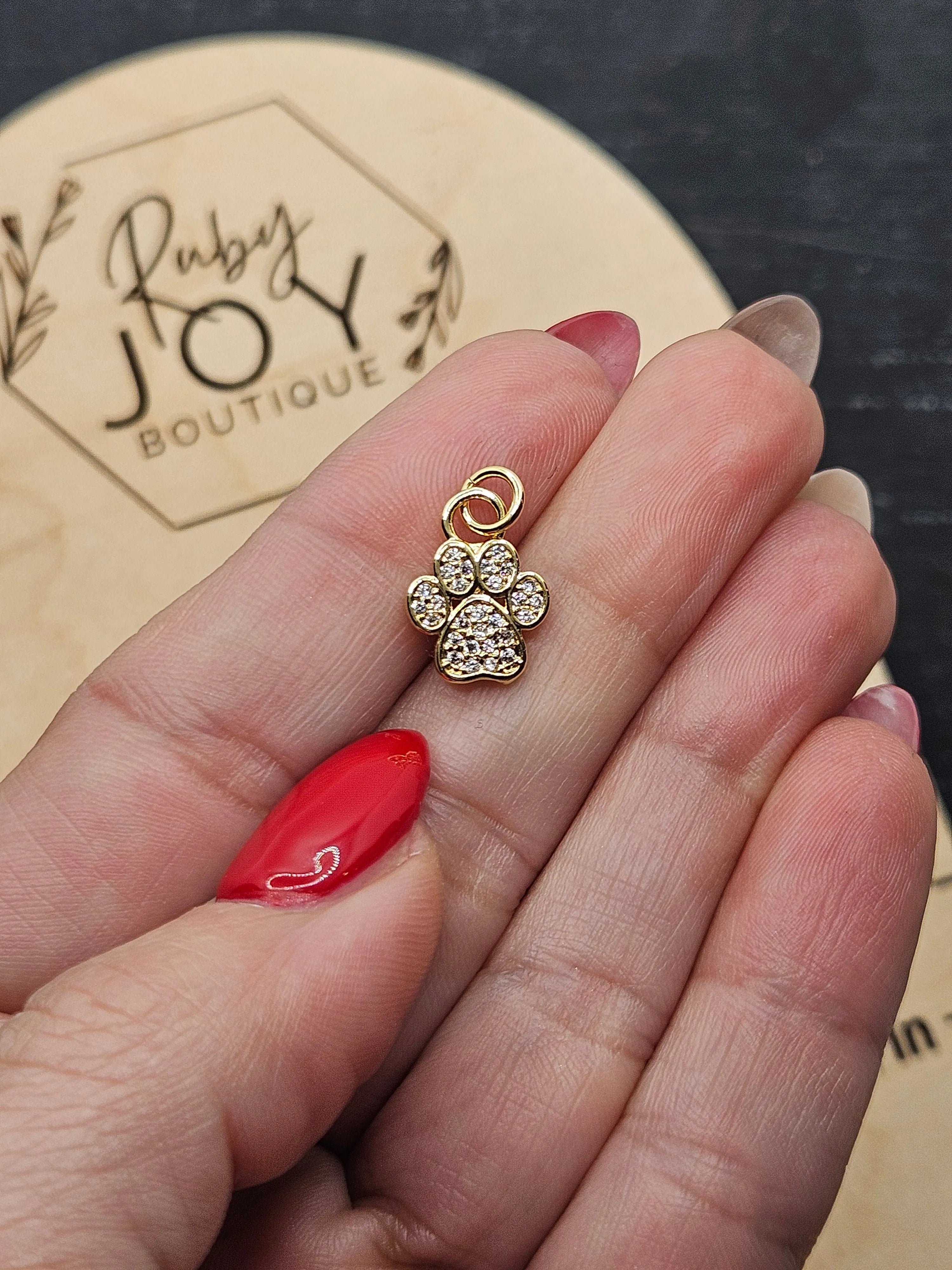 Shop Paw Print Charm- at Ruby Joy Boutique, a Women's Clothing Store in Pickerington, Ohio