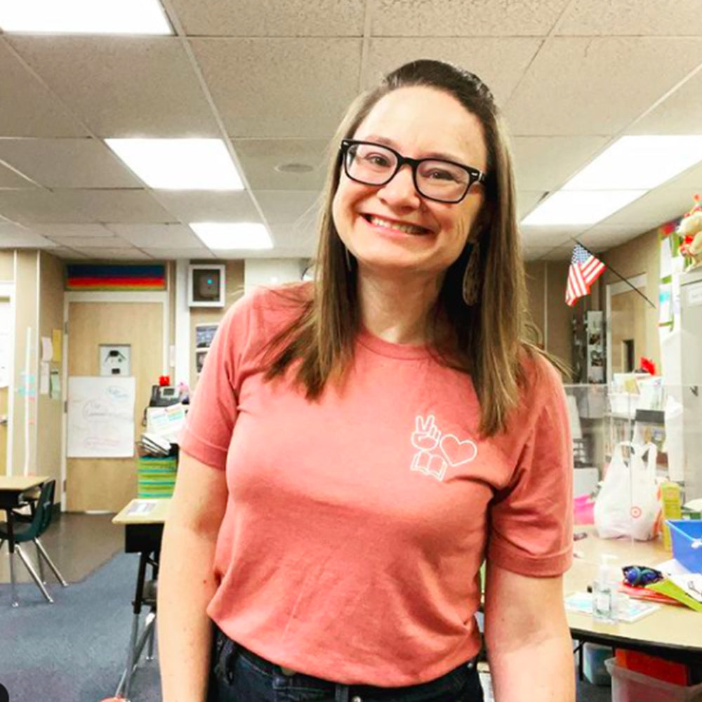 Shop Peace, Love, Books Classic Tee | Kind Cotton- at Ruby Joy Boutique, a Women's Clothing Store in Pickerington, Ohio