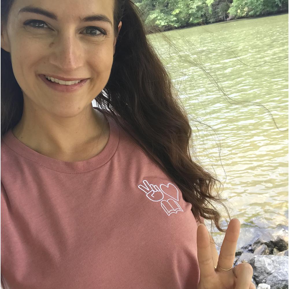Shop Peace, Love, Books Classic Tee | Kind Cotton- at Ruby Joy Boutique, a Women's Clothing Store in Pickerington, Ohio