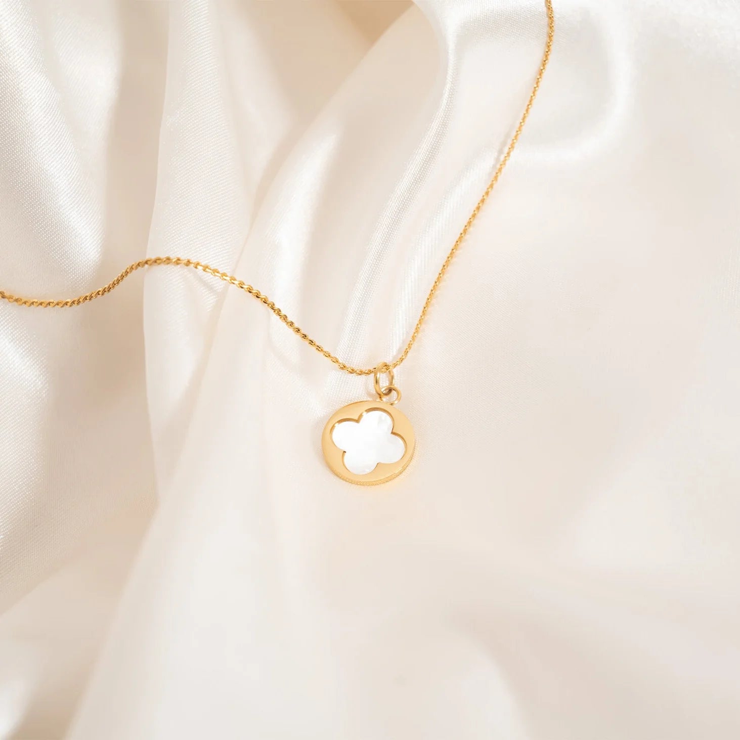 Shop Pearl Quatrefoil Charm- at Ruby Joy Boutique, a Women's Clothing Store in Pickerington, Ohio