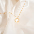 Shop Pearl Quatrefoil Charm- at Ruby Joy Boutique, a Women's Clothing Store in Pickerington, Ohio
