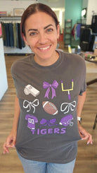 Shop Pickerington Football Bow Collage Stack Graphic Tee- at Ruby Joy Boutique, a Women's Clothing Store in Pickerington, Ohio