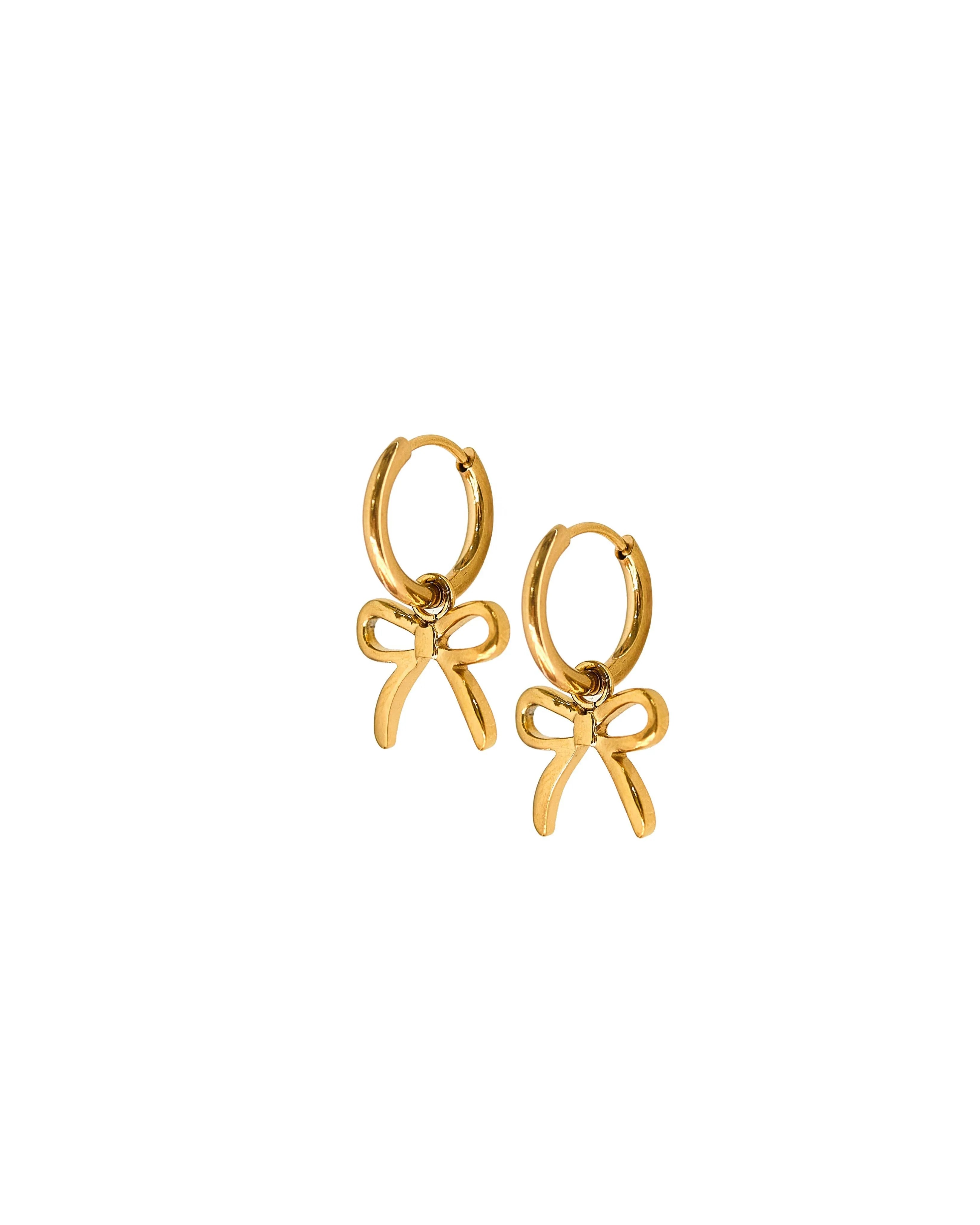 Shop Sadie Bow Huggie Charm Earrings - Gold- at Ruby Joy Boutique, a Women's Clothing Store in Pickerington, Ohio