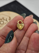 Shop Sunburst Heart Lock Charm- at Ruby Joy Boutique, a Women's Clothing Store in Pickerington, Ohio