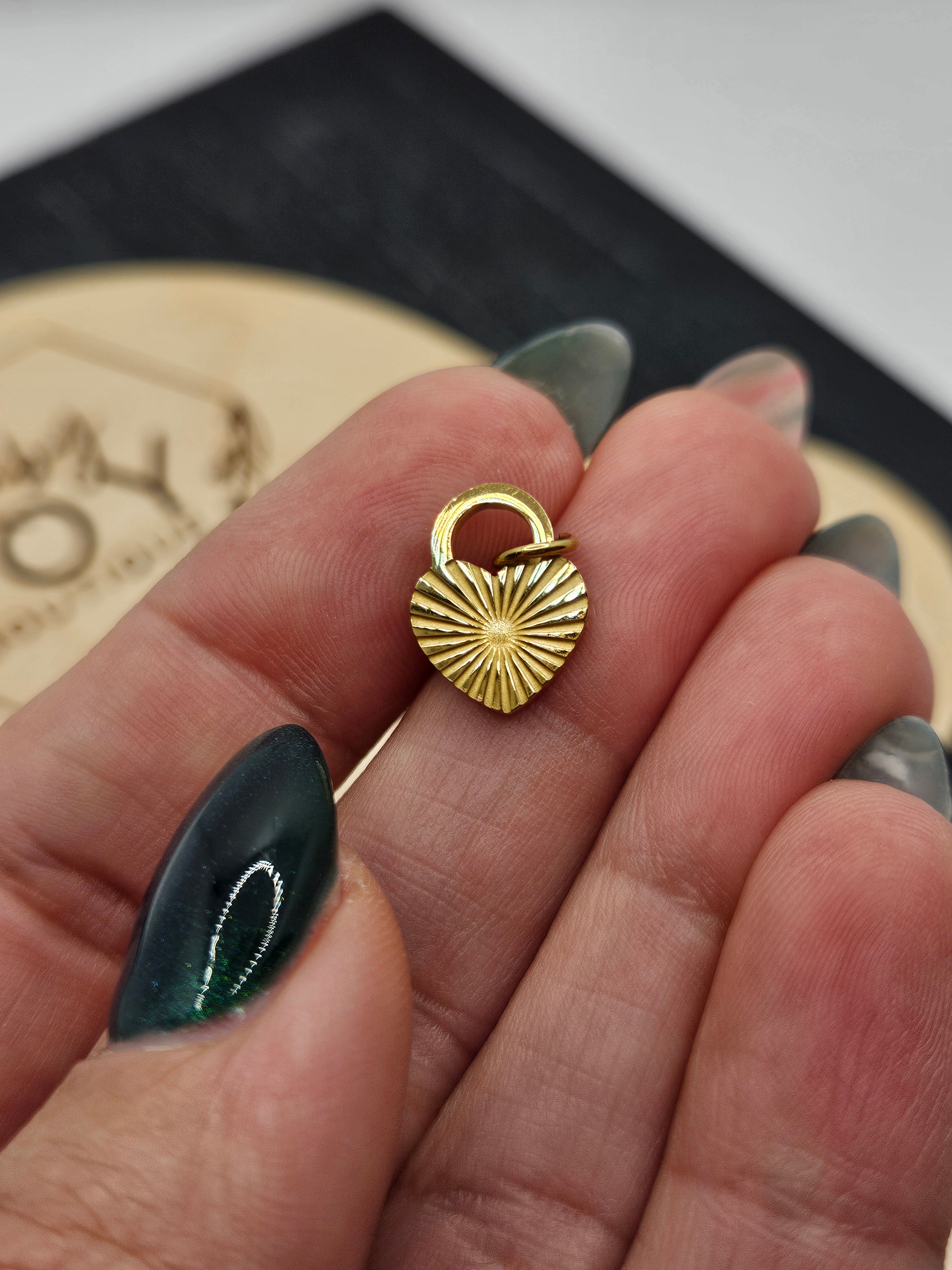 Shop Sunburst Heart Lock Charm- at Ruby Joy Boutique, a Women's Clothing Store in Pickerington, Ohio