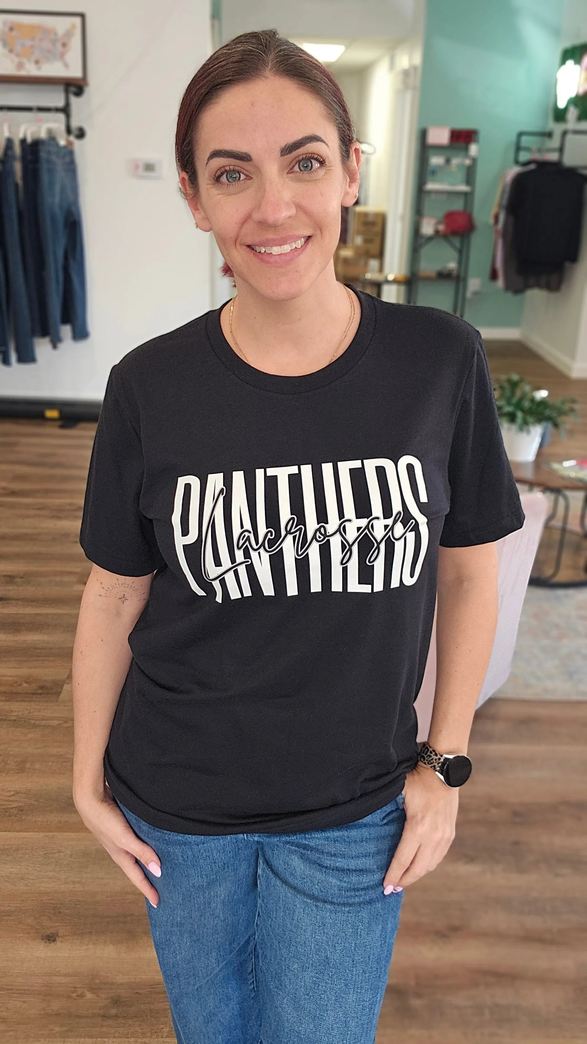 Shop Tall Lacrosse Mascot Text Graphic Top- at Ruby Joy Boutique, a Women's Clothing Store in Pickerington, Ohio