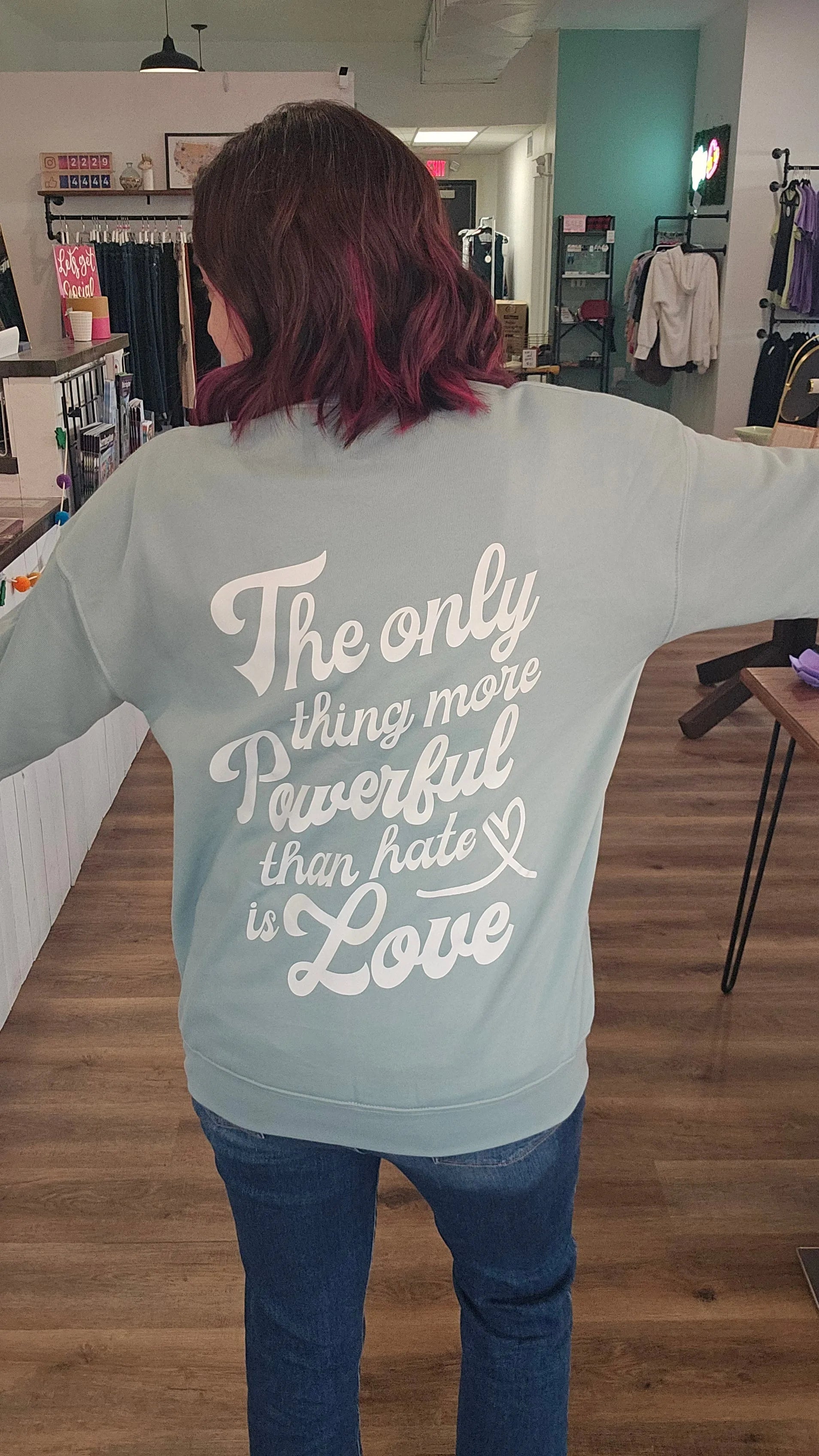 Shop The Only Thing More Powerful Than Hate is Love Back Print | Fundraiser-Sweatshirt at Ruby Joy Boutique, a Women's Clothing Store in Pickerington, Ohio