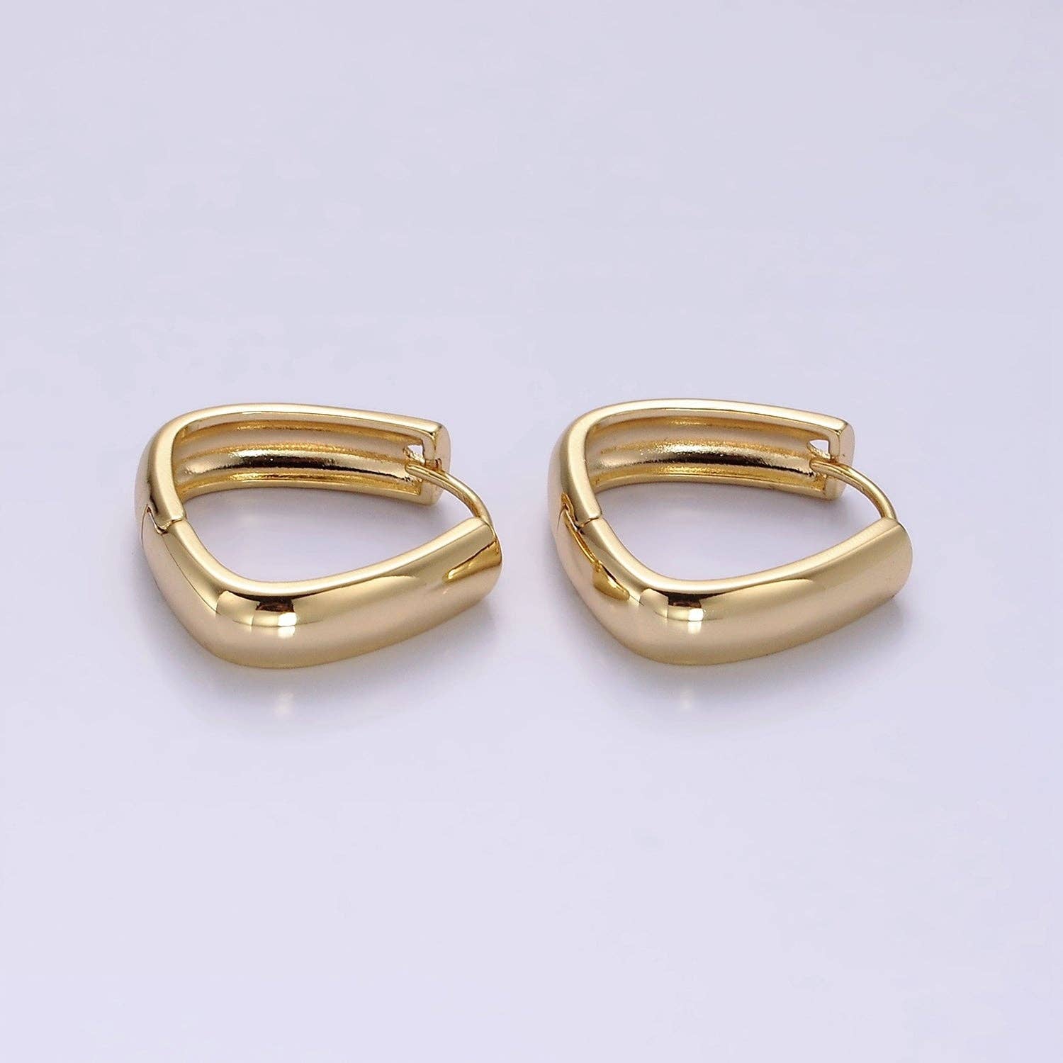 Shop Triangle Huggie Earrings- at Ruby Joy Boutique, a Women's Clothing Store in Pickerington, Ohio