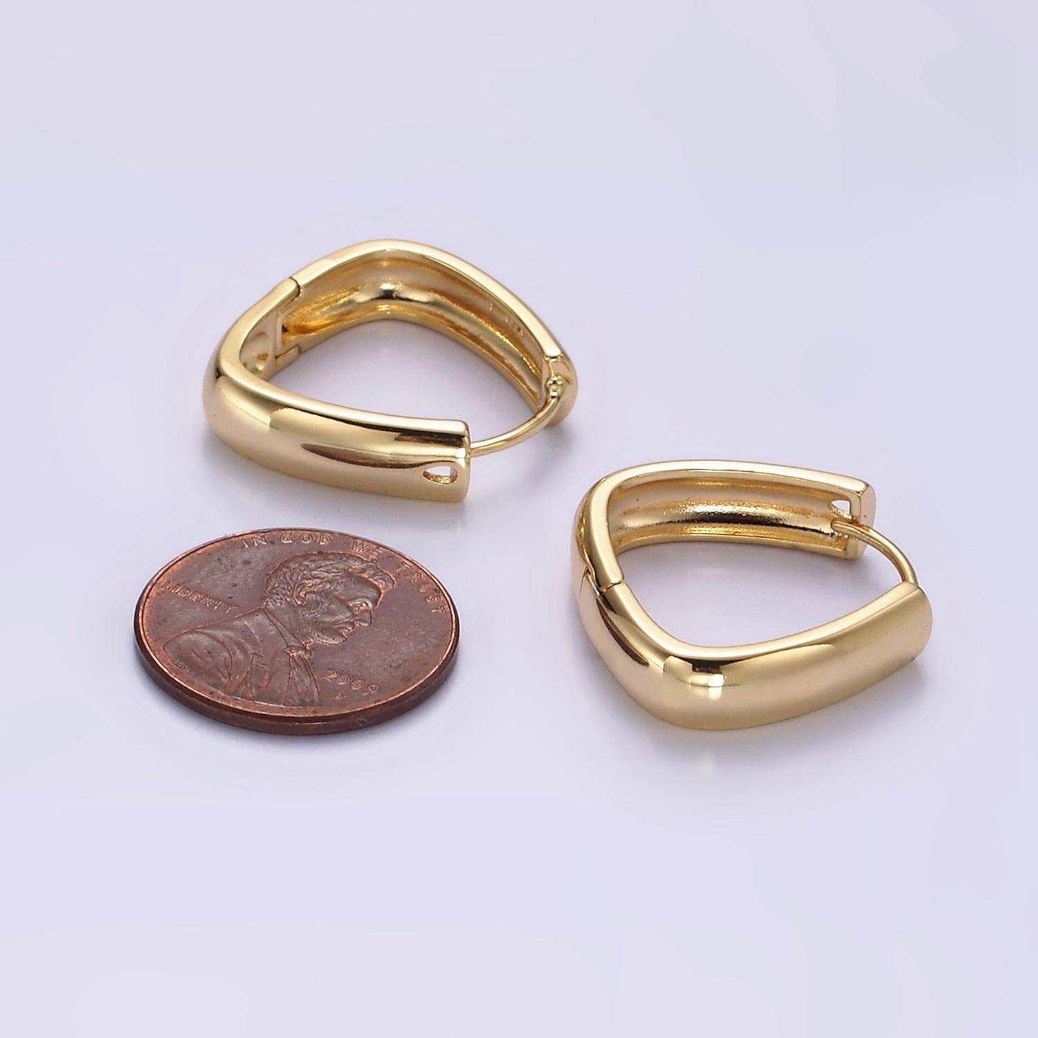 Shop Triangle Huggie Earrings- at Ruby Joy Boutique, a Women's Clothing Store in Pickerington, Ohio