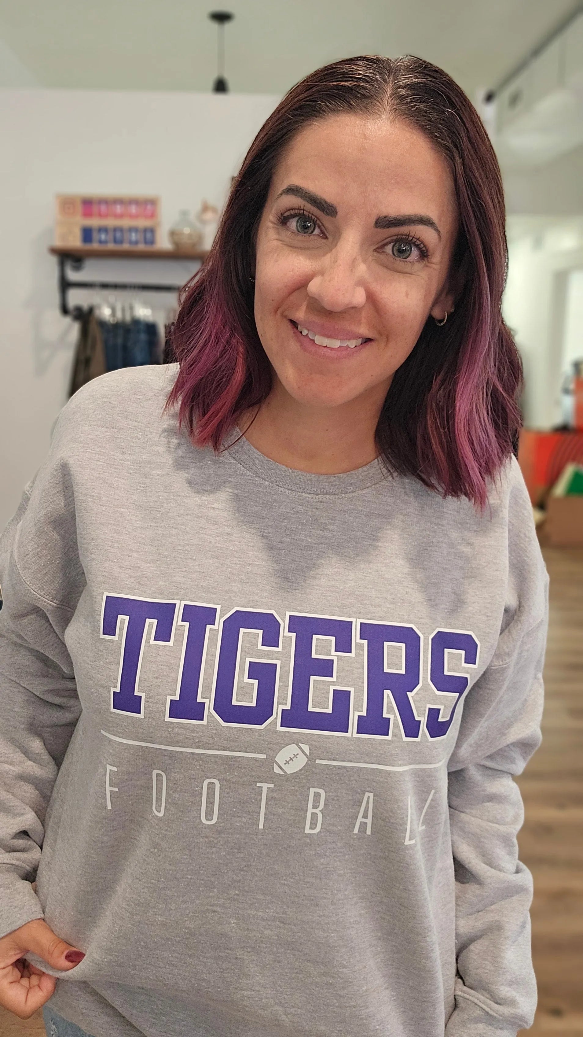 Shop Varsity Football Mascot Sweatshirt- at Ruby Joy Boutique, a Women's Clothing Store in Pickerington, Ohio