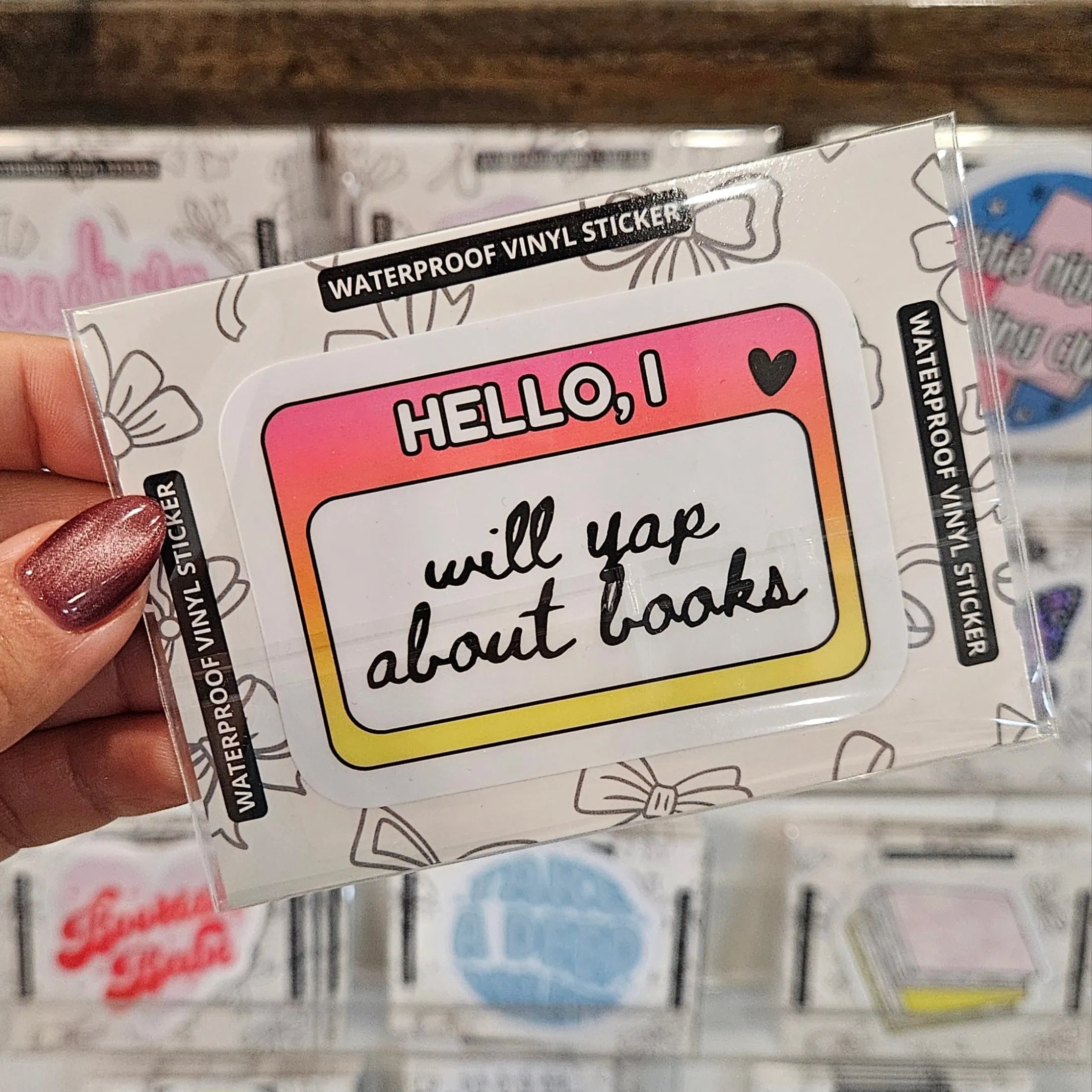 Shop Will Yap About Books Name Tag | Waterproof Vinyl Sticker- at Ruby Joy Boutique, a Women's Clothing Store in Pickerington, Ohio