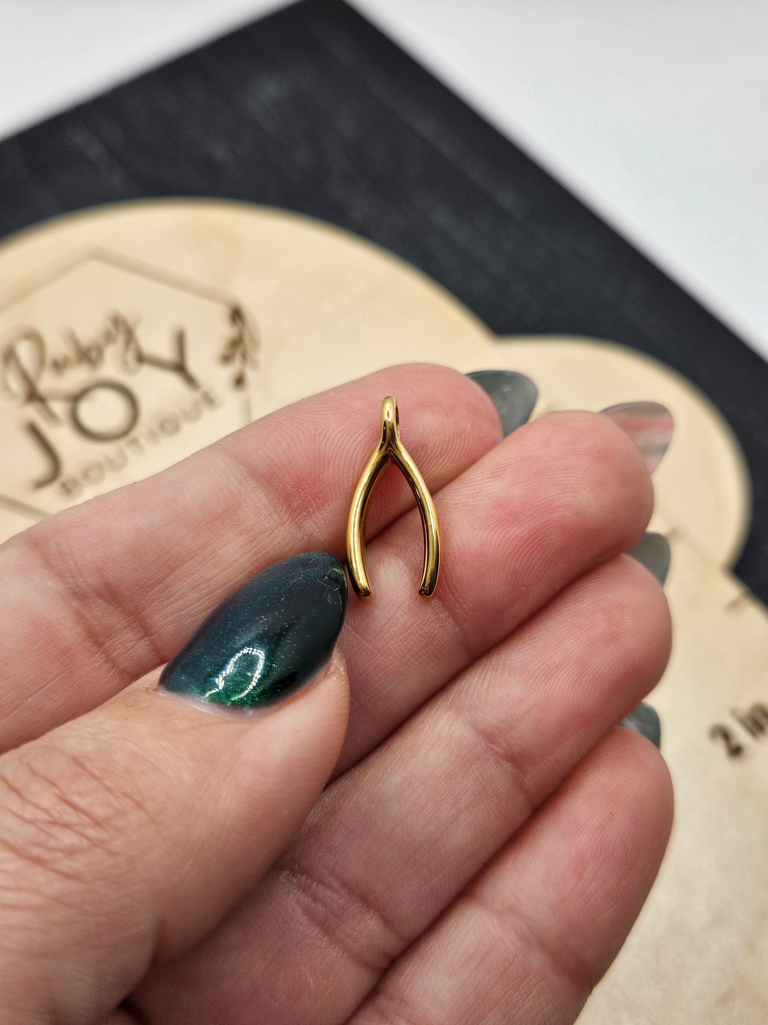 Shop Wishbone Charm- at Ruby Joy Boutique, a Women's Clothing Store in Pickerington, Ohio
