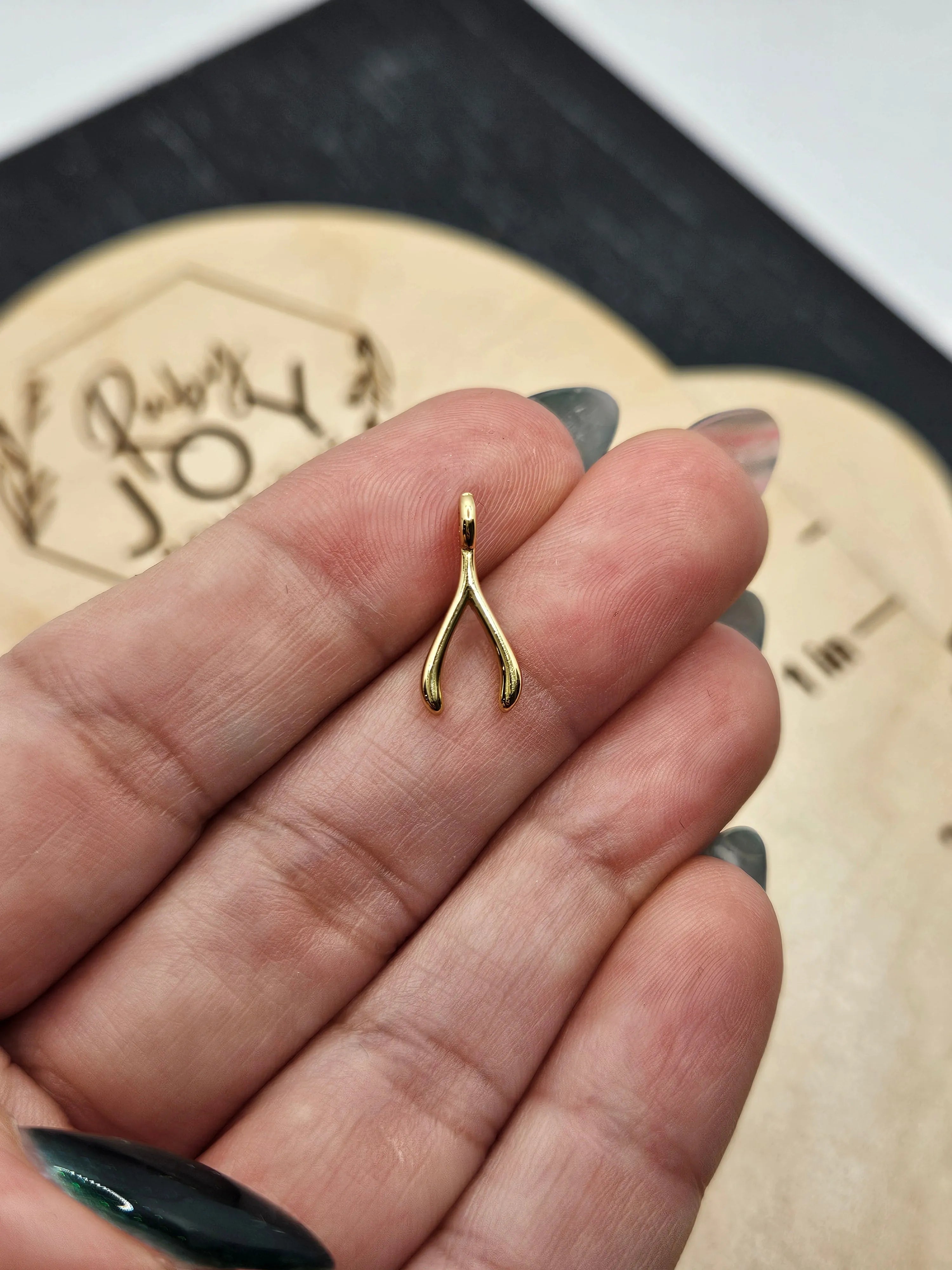 Shop Wishbone Charm- at Ruby Joy Boutique, a Women's Clothing Store in Pickerington, Ohio