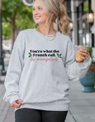 Shop You're What The French Call Les Incompétents Graphic Top | Home Alone Christmas- at Ruby Joy Boutique, a Women's Clothing Store in Pickerington, Ohio