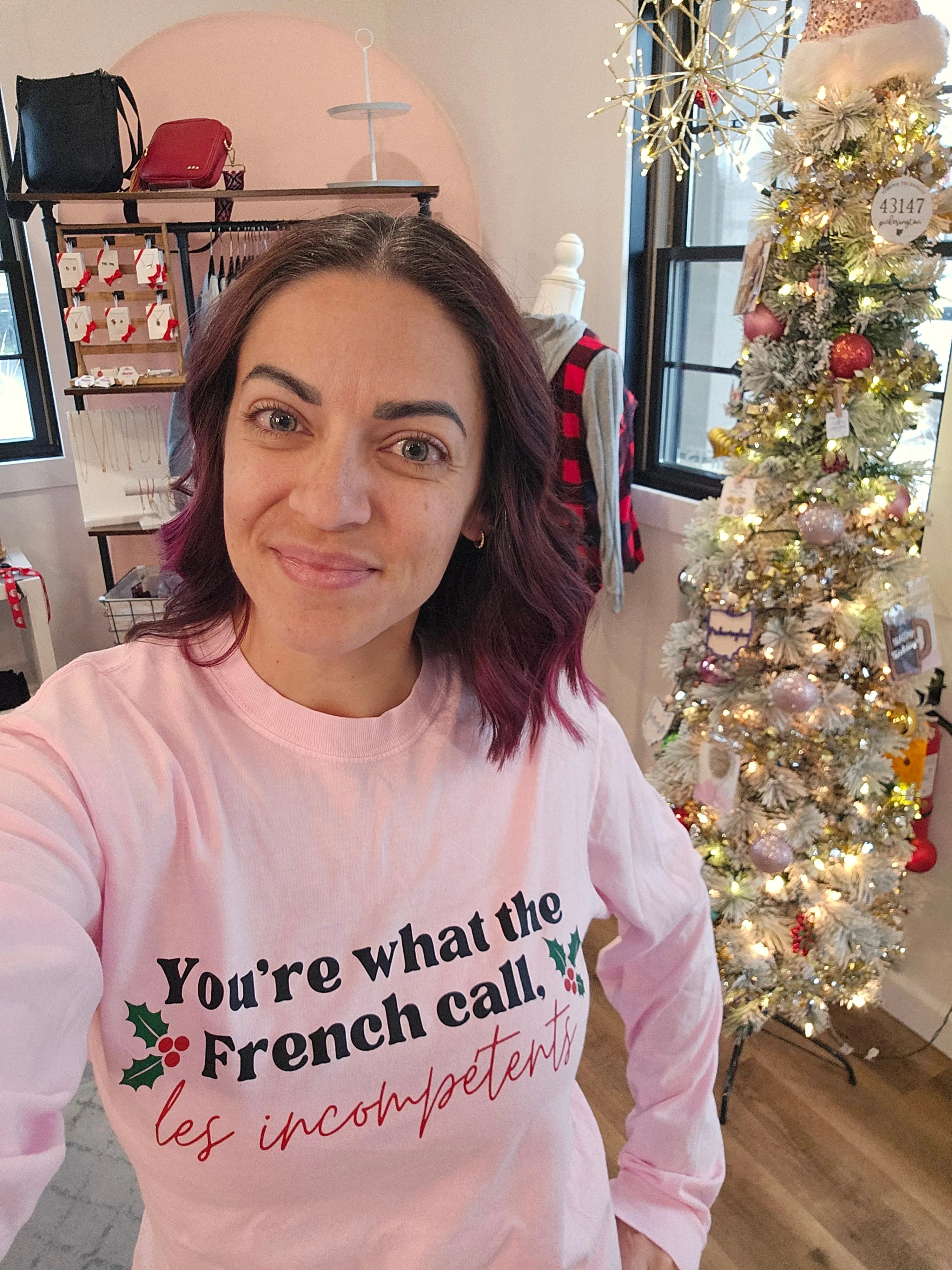 Shop You're What The French Call Les Incompétents Graphic Top | Home Alone Christmas- at Ruby Joy Boutique, a Women's Clothing Store in Pickerington, Ohio